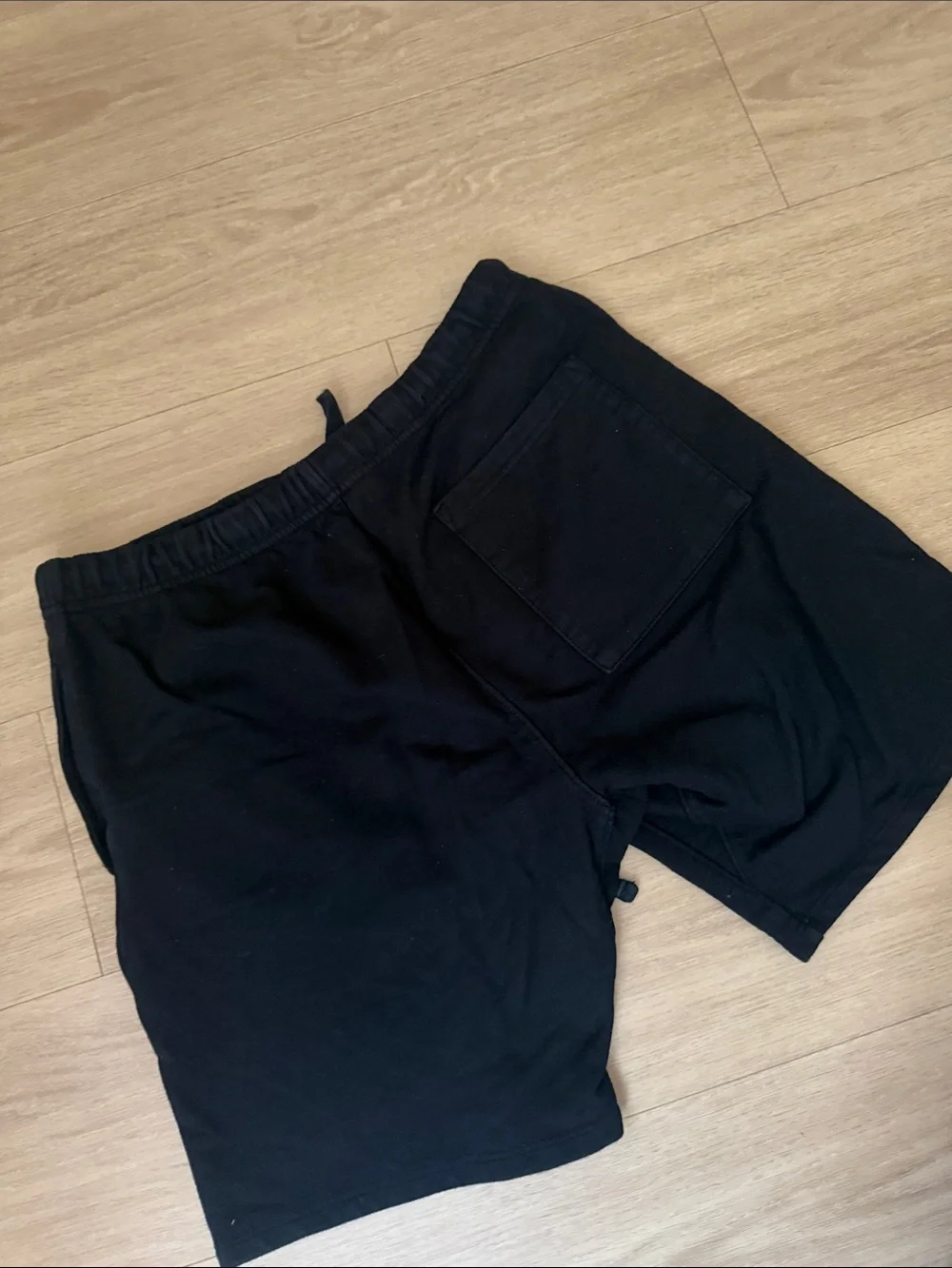 Black Athletic Shorts with Red 'S' Graphic